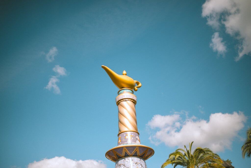 Oil lamp idol on pedestal. 