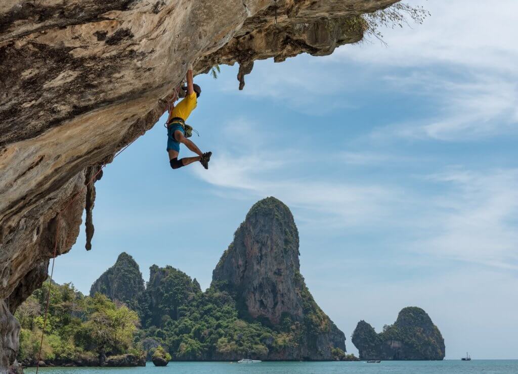 Rock Climber climbing an overhanging cliff